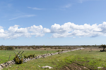 Image showing Wooden stile by a dry stone wall in the great plain grassland Al