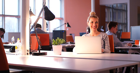 Image showing businesswoman using a laptop in startup office