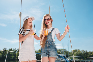 Image showing The children on board of sea yacht