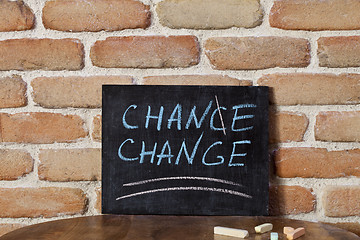 Image showing Black board with the phrase CHANCE CHANGE drown by hand on woode