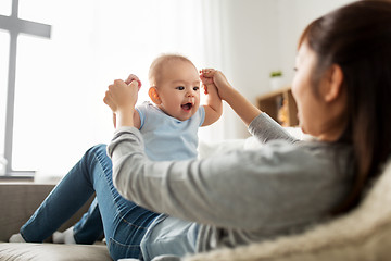 Image showing happy mother with little baby son at home