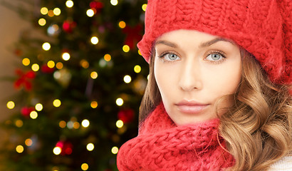 Image showing woman in hat and scarf over christmas lights