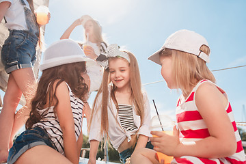 Image showing The children on board of sea yacht