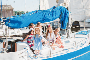 Image showing The children on board of sea yacht