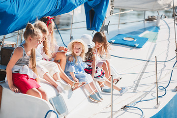 Image showing The children on board of sea yacht