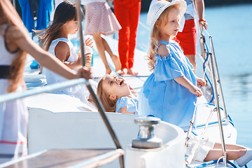 Image showing The children on board of sea yacht