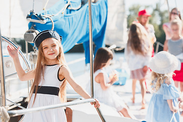 Image showing The children on board of sea yacht