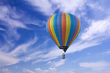 Image showing Colorful hot-air balloon flying in the blue sky