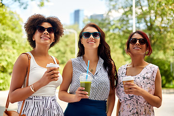 Image showing happy women or friends with drinks at summer park