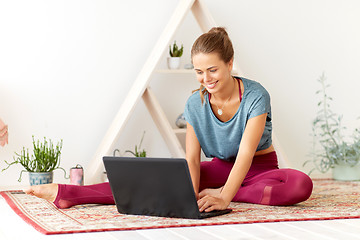 Image showing woman with laptop computer at yoga studio