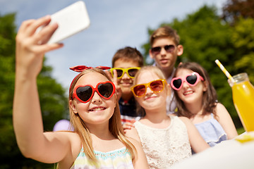 Image showing happy kids taking selfie on birthday party