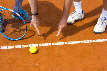 Image showing Tennis players shows the track on the tennis court