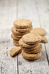 Image showing Fresh oat cookies on rustic wooden table.