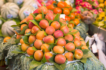 Image showing Bunch of fresh apricots for sale in market