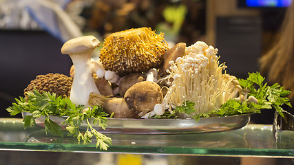 Image showing Various types of mushrooms in a tin plate