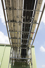 Image showing Metal tubes for mechanical ventilation system on an industrial p