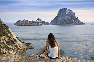 Image showing Ibiza, young girl looking to mountains sea