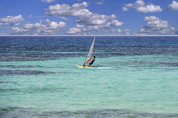 Image showing Windsurfing on sea and blue sky background