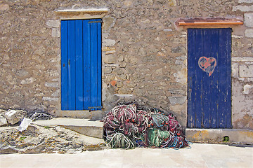 Image showing Old wooden doors and fishing nets in Formentera 