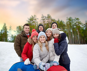 Image showing friends with snow tubes taking selfie in winter