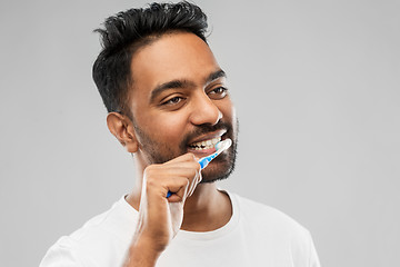 Image showing indian man with toothbrush cleaning teeth