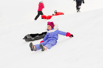 Image showing little kids with sleds on snow hill in winter