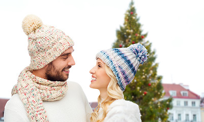 Image showing happy couple over christmas tree in tallinn