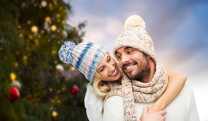 Image showing happy couple hugging over christmas tree