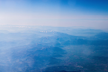 Image showing Mountain view from an airplane window.