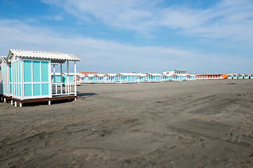 Image showing Beautiful black sandy beach with beach houses