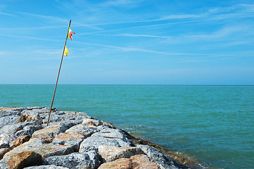 Image showing Beautiful azure sea and the rocky beach