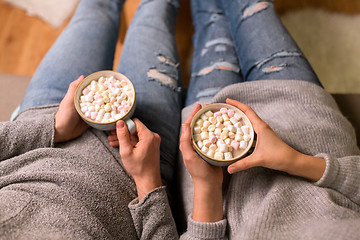 Image showing close up of couple drinking hot chocolate at home