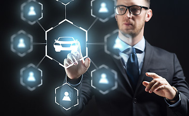 Image showing businessman with virual hologram of car sharing