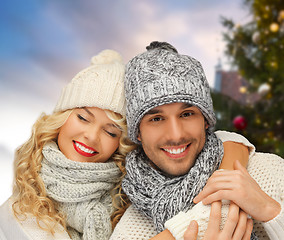 Image showing happy couple hugging over christmas tree