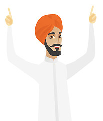 Image showing Hindu businessman standing with raised arms up.