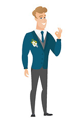 Image showing Smiling groom showing ok sign.