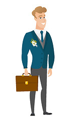 Image showing Caucasian groom holding briefcase.