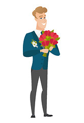 Image showing Caucasian groom holding a bouquet of flowers