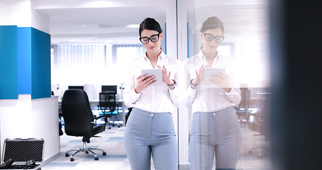 Image showing Business Woman Using Digital Tablet in front of Office