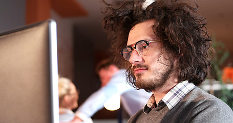 Image showing businessman working using a computer in startup office