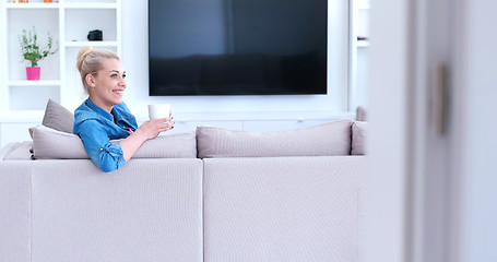 Image showing woman enjoying a cup of coffee