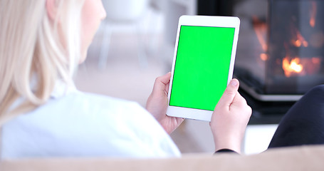 Image showing woman on sofa using tablet computer