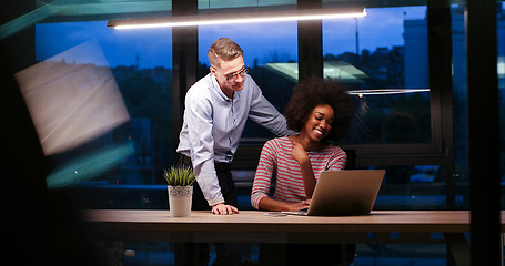 Image showing Multiethnic startup business team in night office