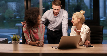 Image showing Multiethnic startup business team in night office