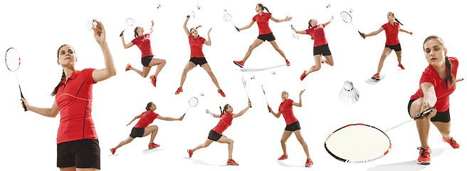 Image showing Young woman playing badminton over white background