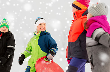 Image showing happy little kids with sleds in winter