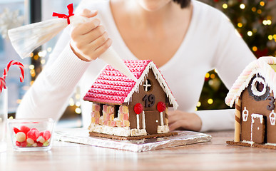 Image showing woman making gingerbread houses on christmas