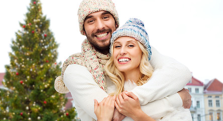 Image showing happy couple hugging over christmas tree