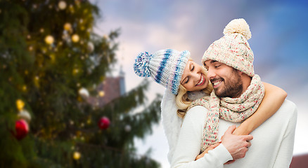 Image showing happy couple hugging over christmas tree