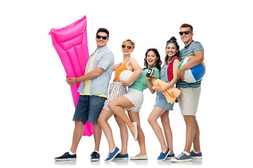 Image showing happy friends with beach and summer accessories